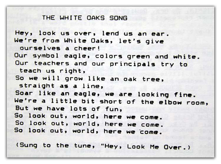 Black and white photograph of the school song lyrics from a yearbook.